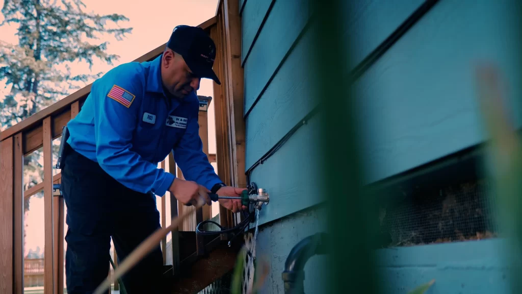 a man fixing a faucet